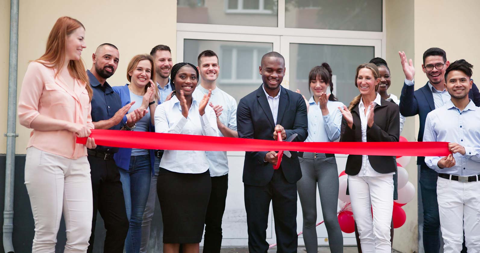 Grand opening event of LeMarie Photography in Baton Rouge, LA, featuring ribbon-cutting ceremony and guests enjoying the Magic Mirror Photo Booth ,360 Photo Booth, Selfie Wi-Fi, and Selfie Fi experiences